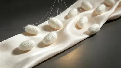 Close-up of a real mulberry silk scarf showing soft natural luster